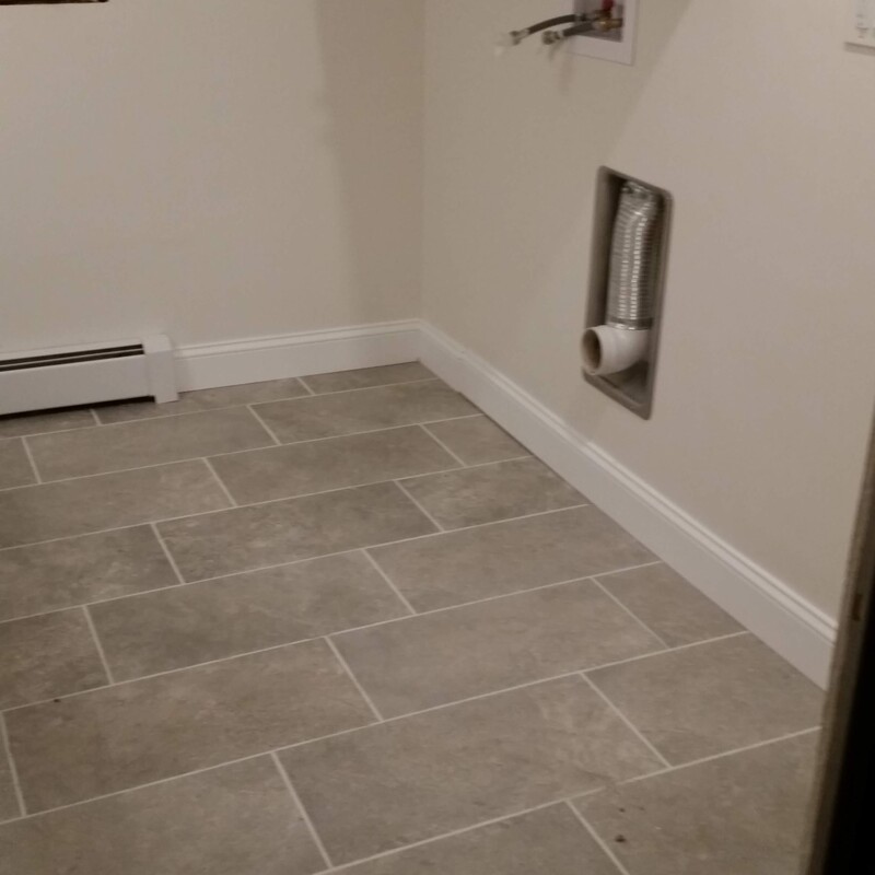 The recessed dryer vent allows the washer and dryer to be closer to the wall, gaining an extra 5 inches of laundry space. Upper cabinets were also shimmed outward for better accessibility.